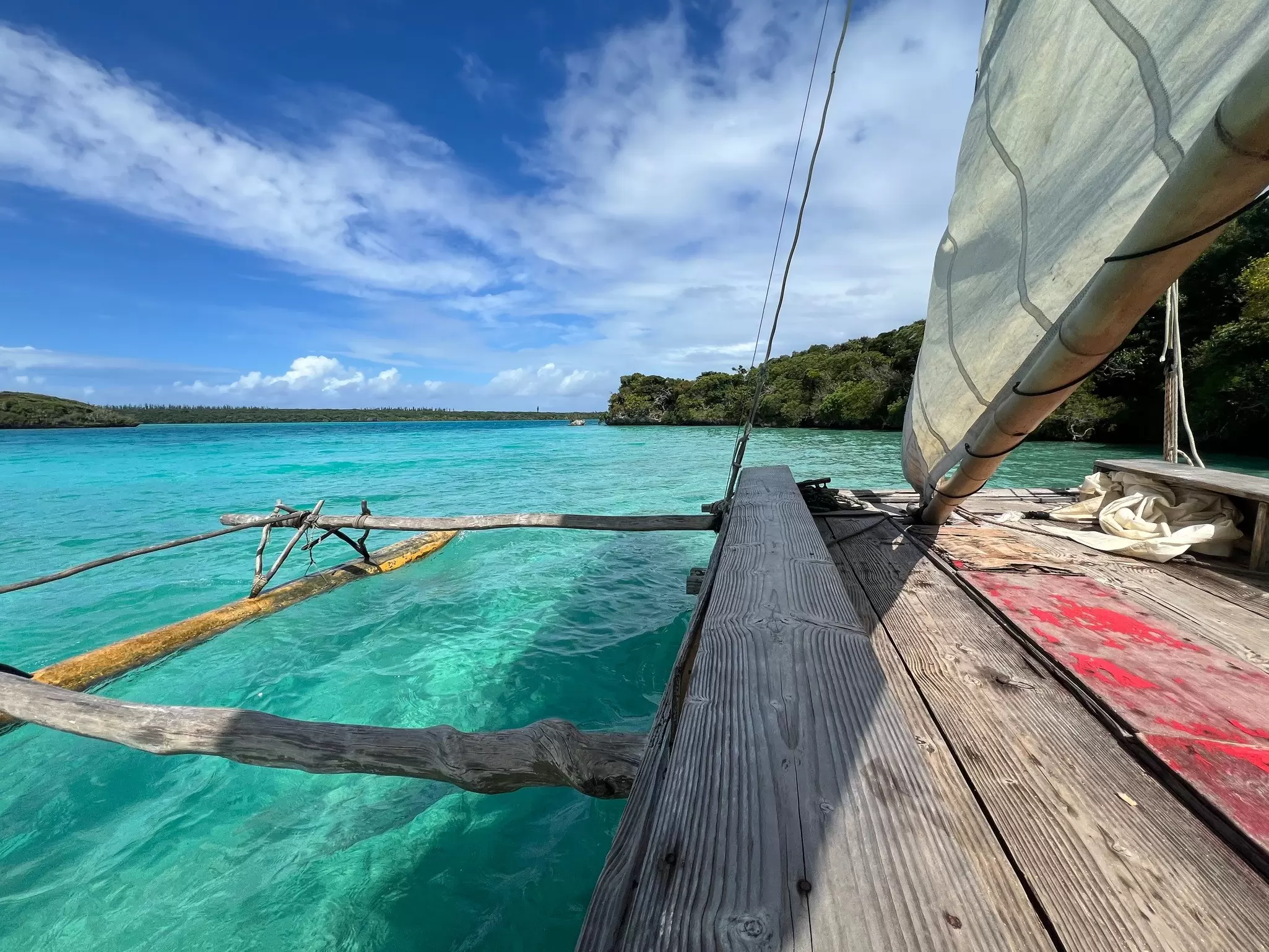 ÎLES DES PINS, NEW CALEDONIA, DECEMBER 2025. Sailing in an outrigger canoe on the Isle of Pines.