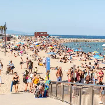 BARCELONA - JUNE 26, 2020: Platja de la Nova Icària beach with people in summer after COVID 19 on June 26, 2020 in Barcelona, Spain.