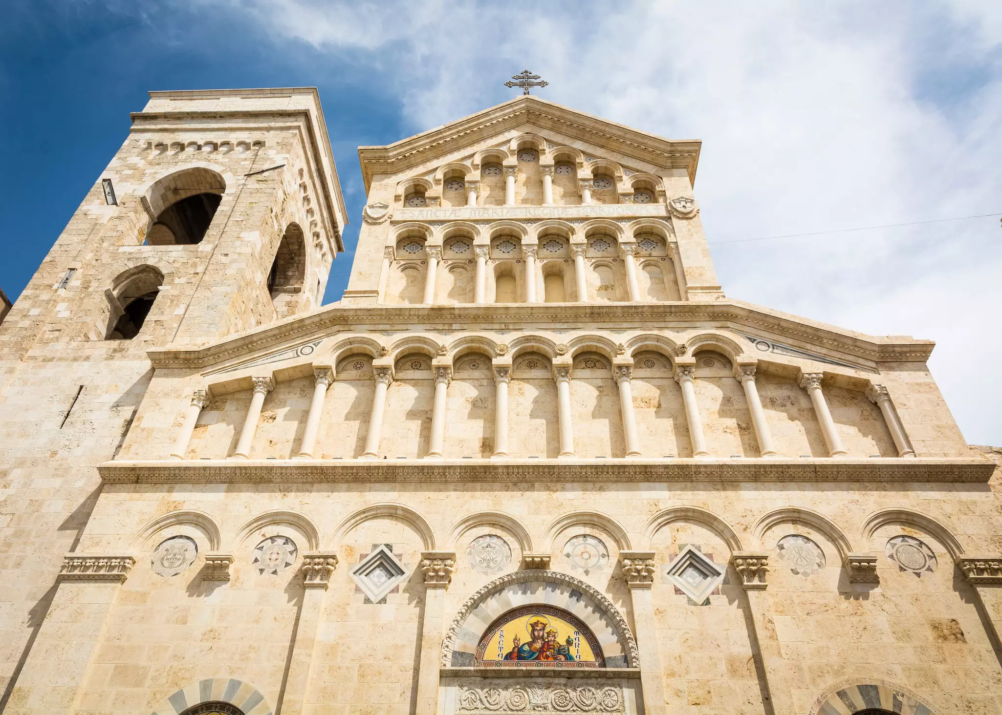 A 13th-century cathedral with a restored facade and rectangular bell tower.