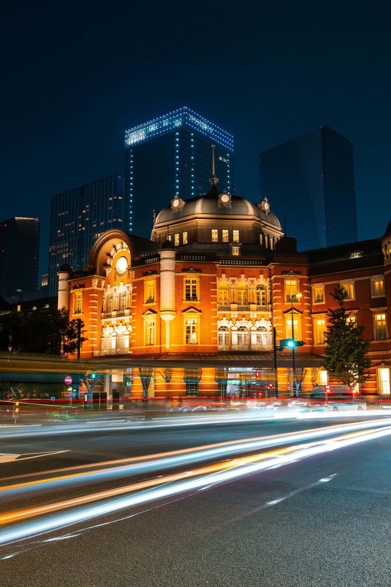 Cars passing in front of  Tokyo Station, Japan.