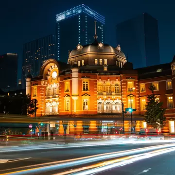 Cars passing in front of  Tokyo Station, Japan.