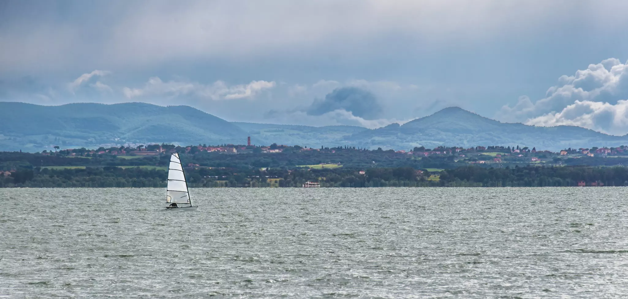 Lake Trasimeno, as seen from Passignano. The lake is one of Italy's largest and great for watersports © Getty Images