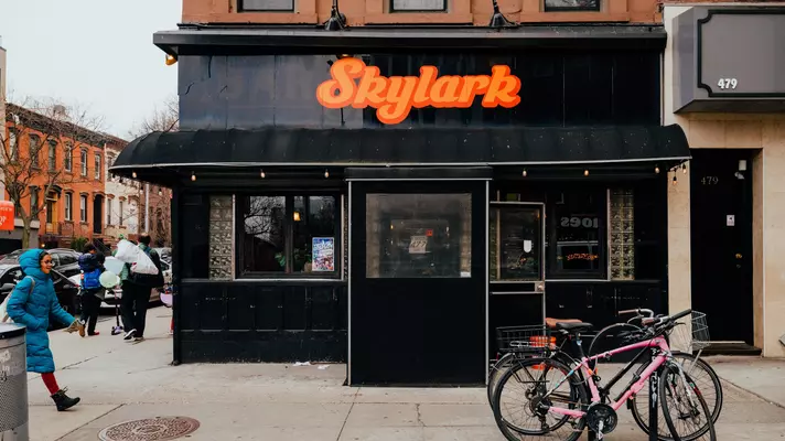 The exterior of a bar with the sign "Skylark"