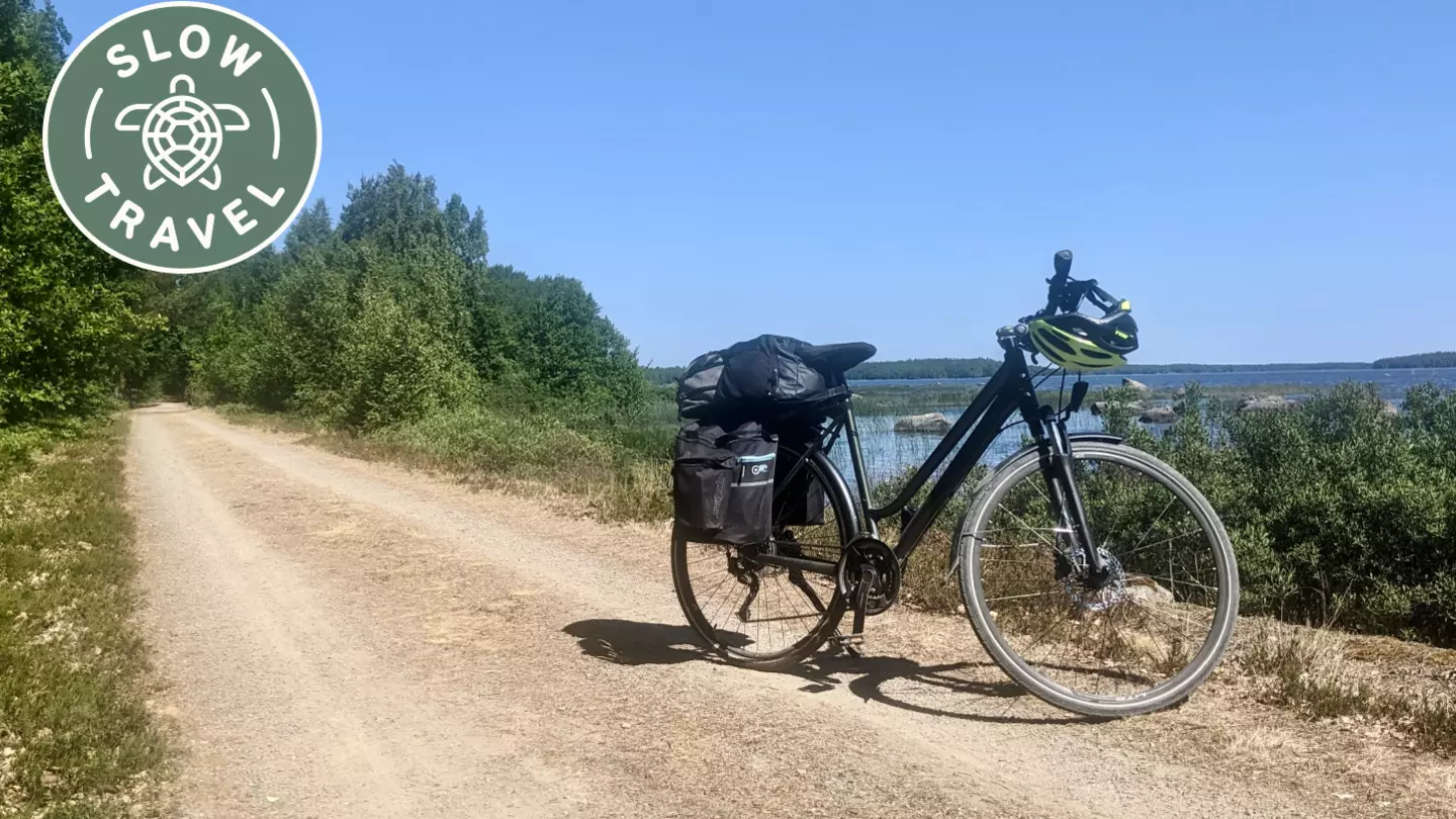 Pedaling past serene lakes and ancient forests helped our writer slow down © Amy Lynch / Lonely Planet