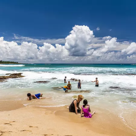 Pingtung, Taiwan: Tourists playing on the beautiful Baishawan coastal reef and sea waves in Kenting National Park of Pingtung, Taiwan.