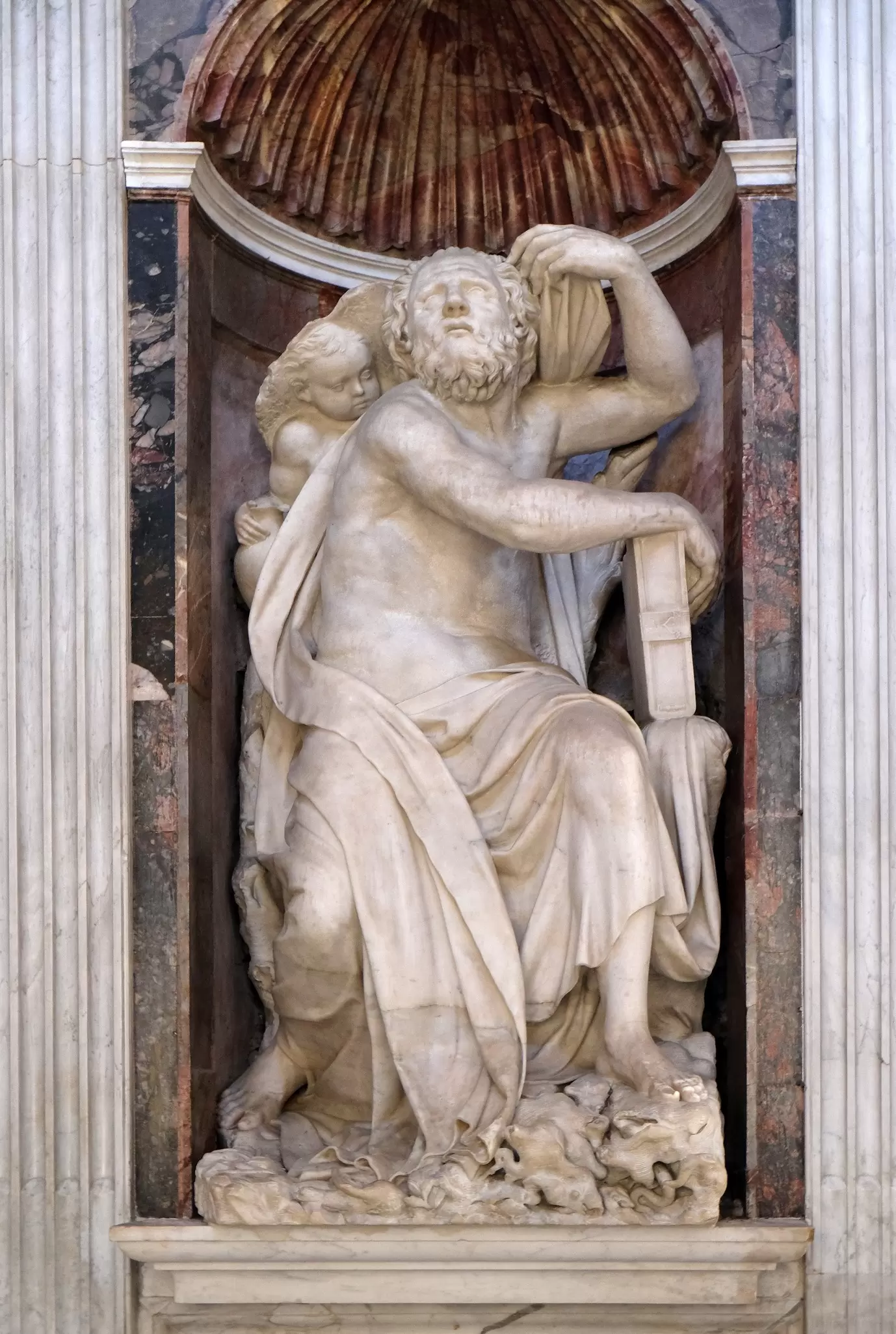 A marble statue by Lorenzetto of the prophet Elias and an angel in the Chigi Chapel in the Basilica Santa Maria del Popolo in Rome, Italy.