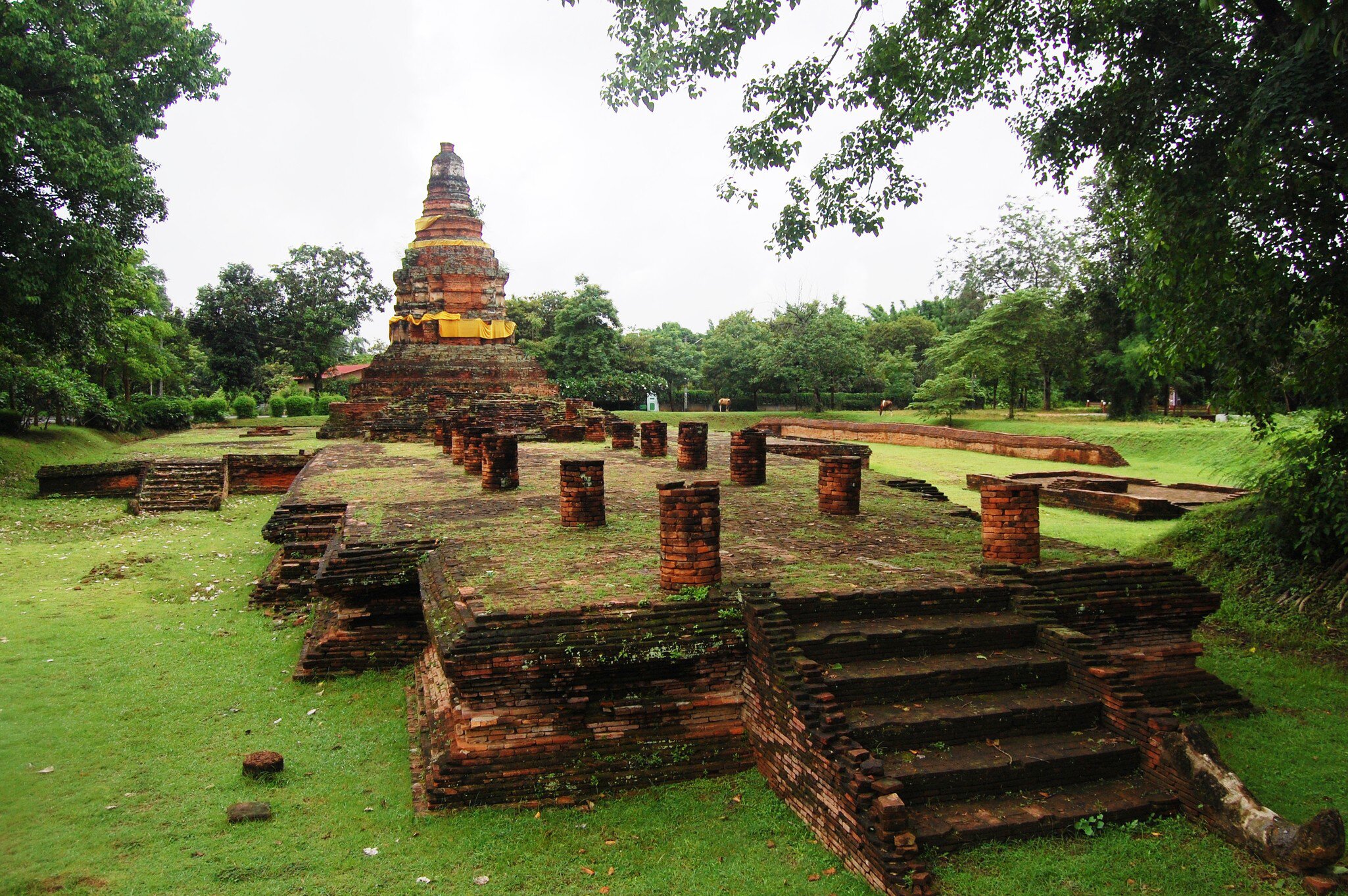 Wiang Kum Kam in Chiang Mai, Thailand. monument surrounded by greenery.