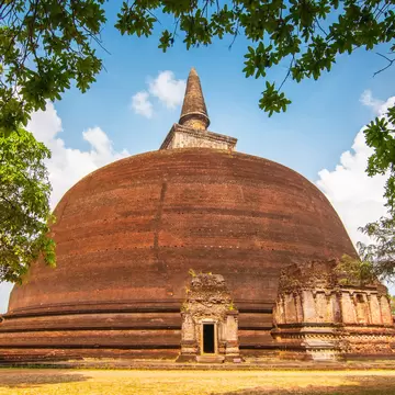 View of the Rankoth Vehera, the largest Buddhist stupa at the ruins of the ancient kingdom capitol of Polonnaruwa, Sri Lanka.  