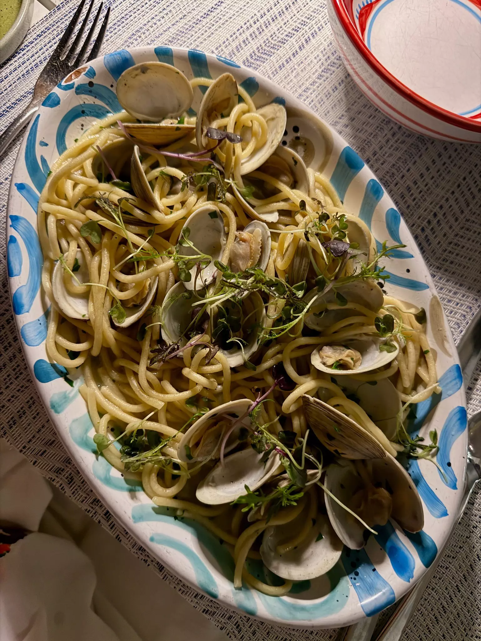 A plate loaded with spaghetti and clams