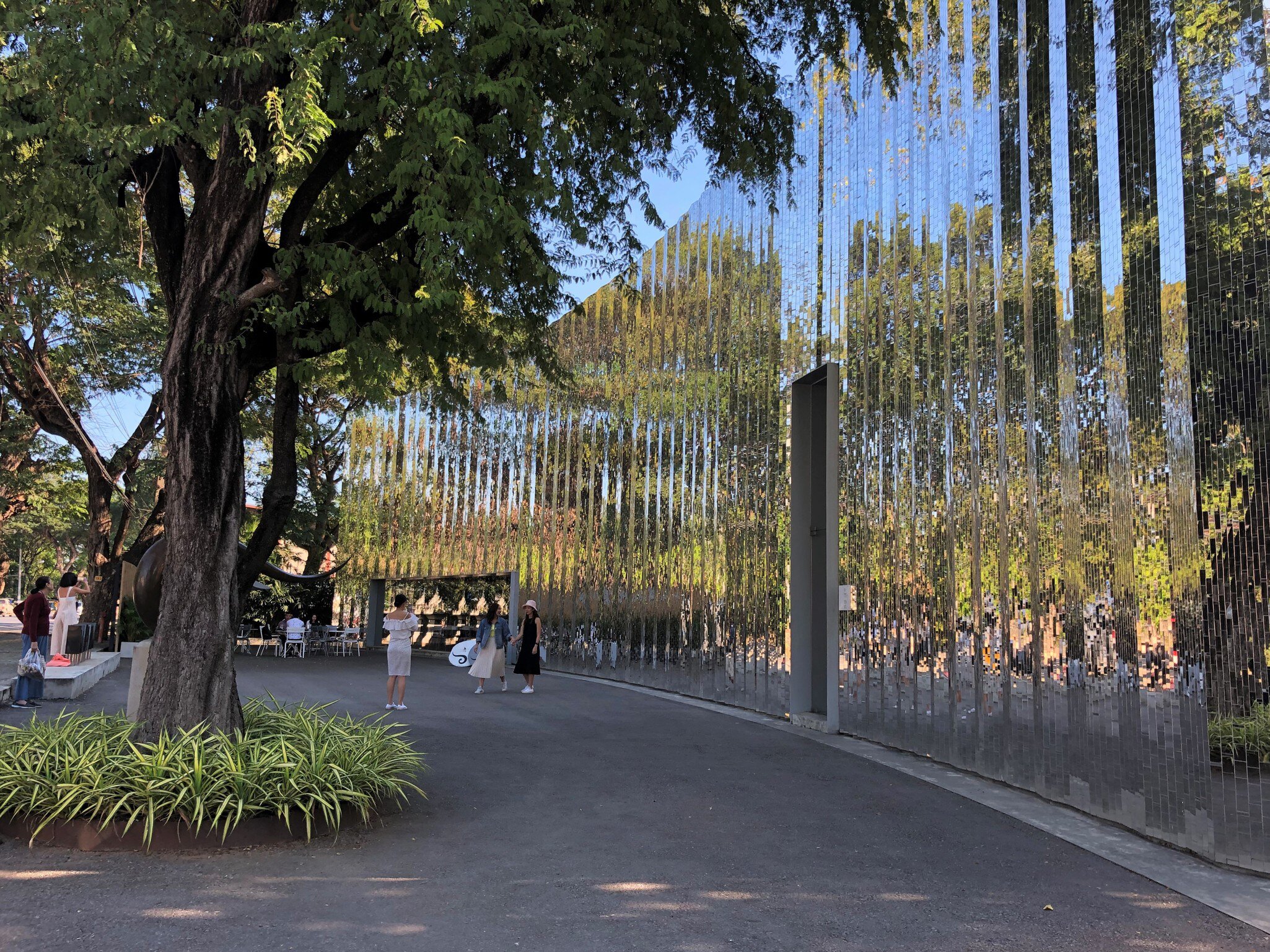 Exterior of MAIIAM Contemporary Art Museum in Chiang Mai, Thailand. Wiinding, reflective surface.