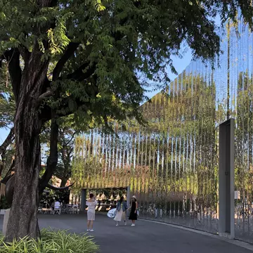 Exterior of MAIIAM Contemporary Art Museum in Chiang Mai, Thailand. Wiinding, reflective surface.