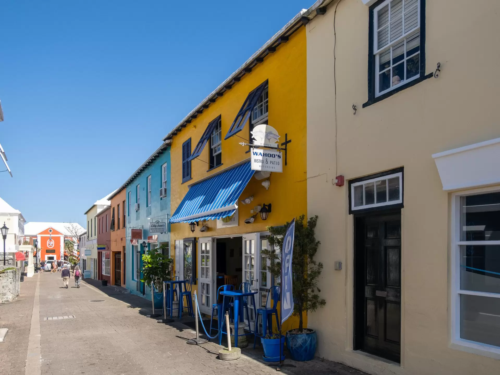 Colorful shops and restaurants lining a narrow street in Bermuda