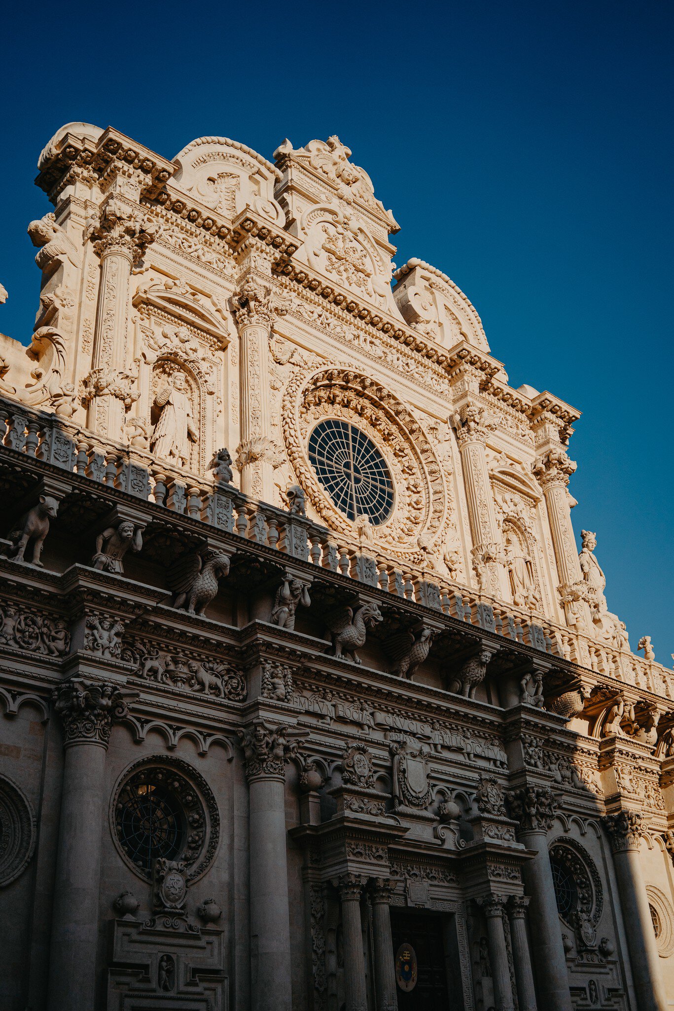 Basilica di Santa Croce lit up by the sun in Lecce, Italy