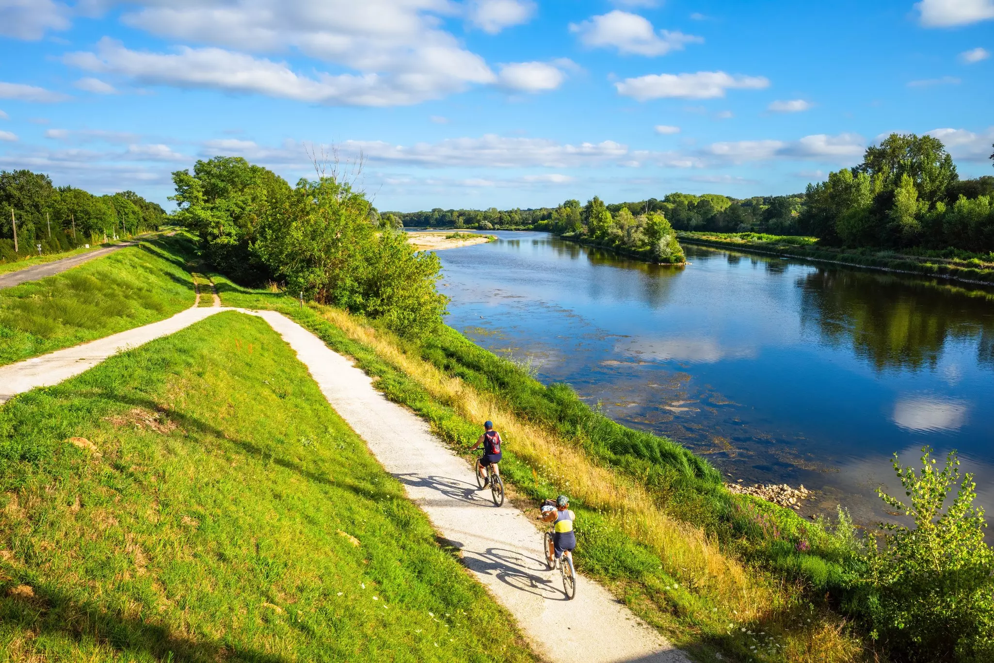 Cyclists ride on thefra cycle path along the Loire River in France.