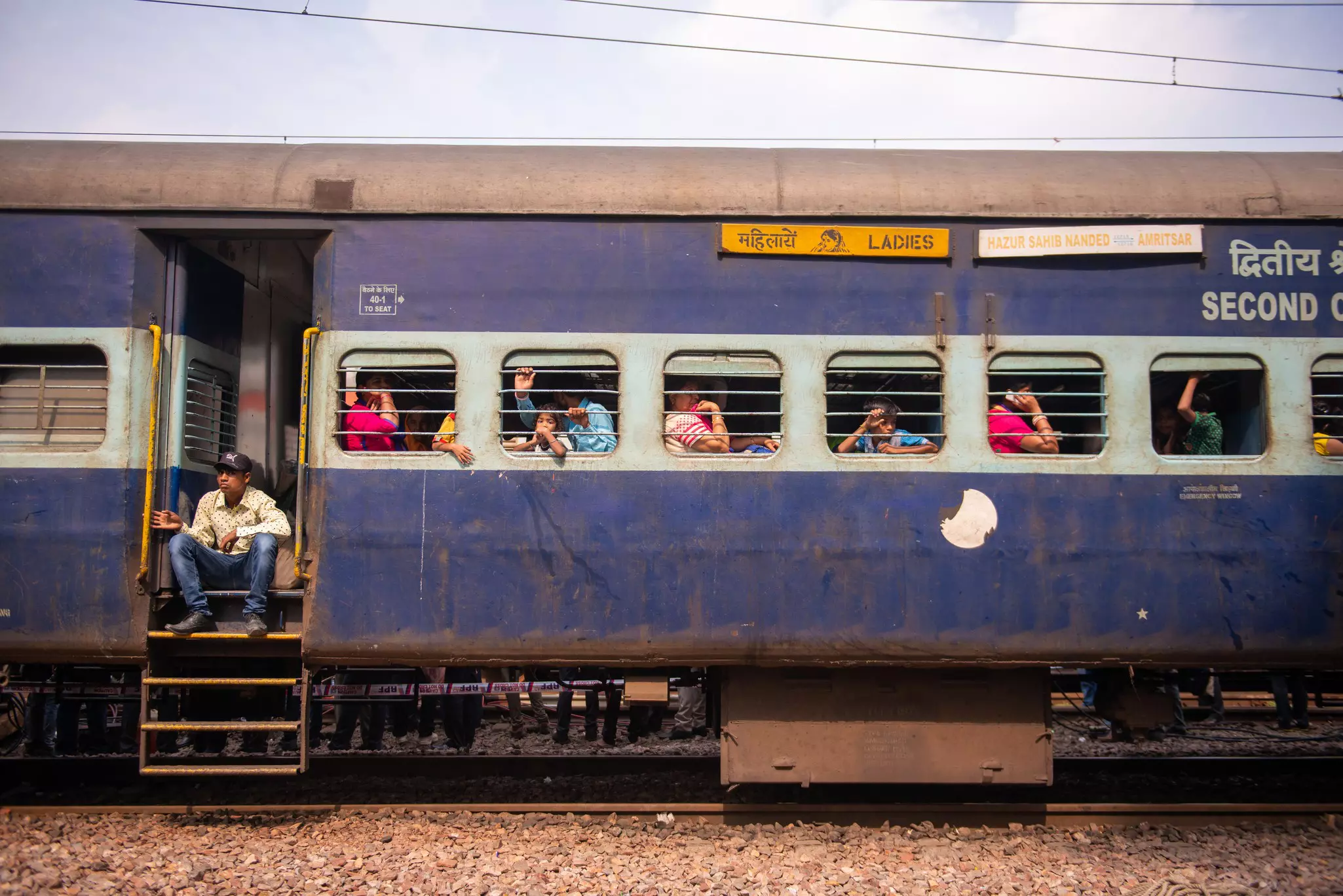If a train has a dedicated car for women, find a seat there © PradeepGaurs / Shutterstock