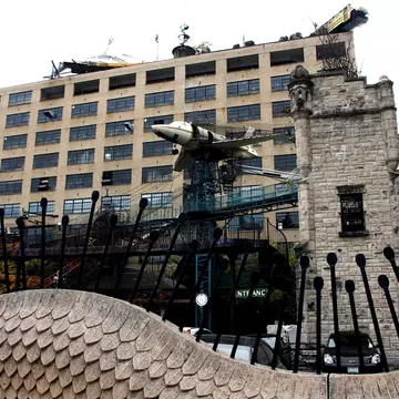 Saint Louis, Mo—November, 3, 2017, view of the playground at the City Museum with airplane tower and hanging school bus.; Shutterstock ID 748639639;