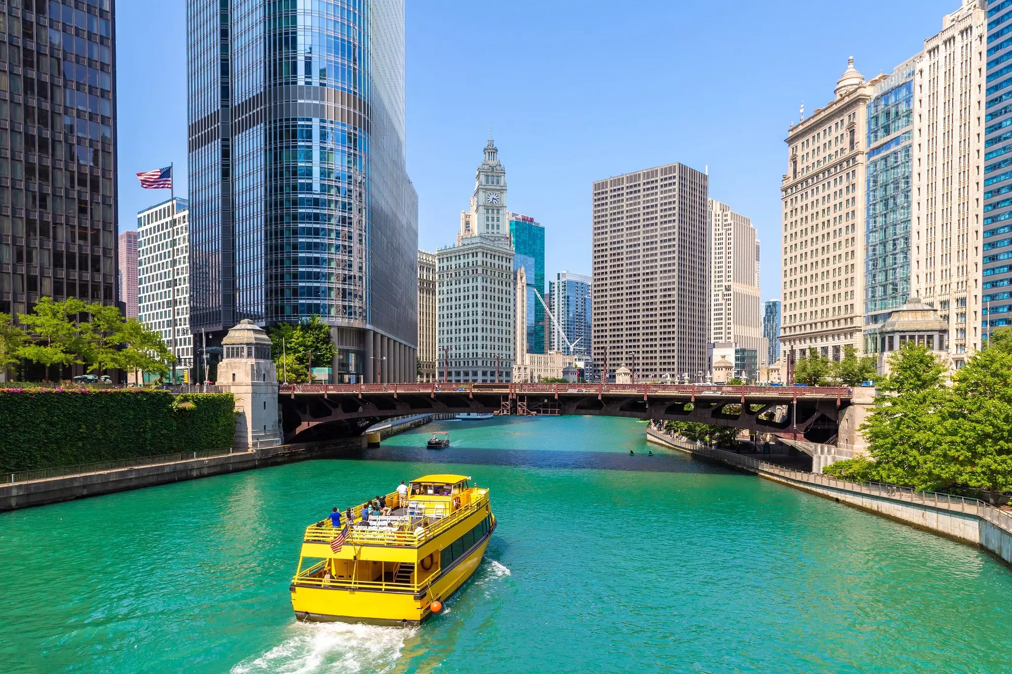 A yellow tour boat on the Chicago River in Chicago, Illinois, USA.