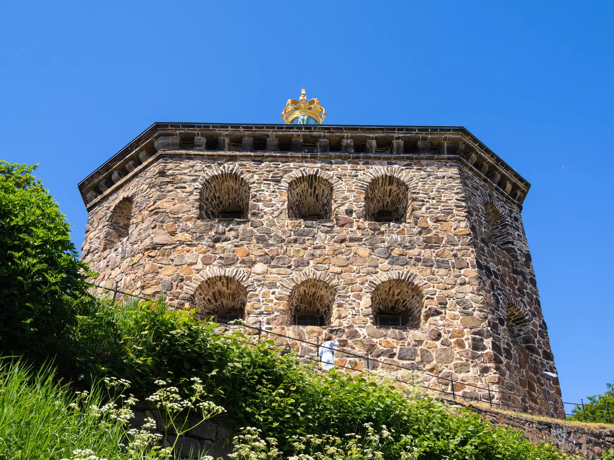 An old fortress with a gilded crown on the roof