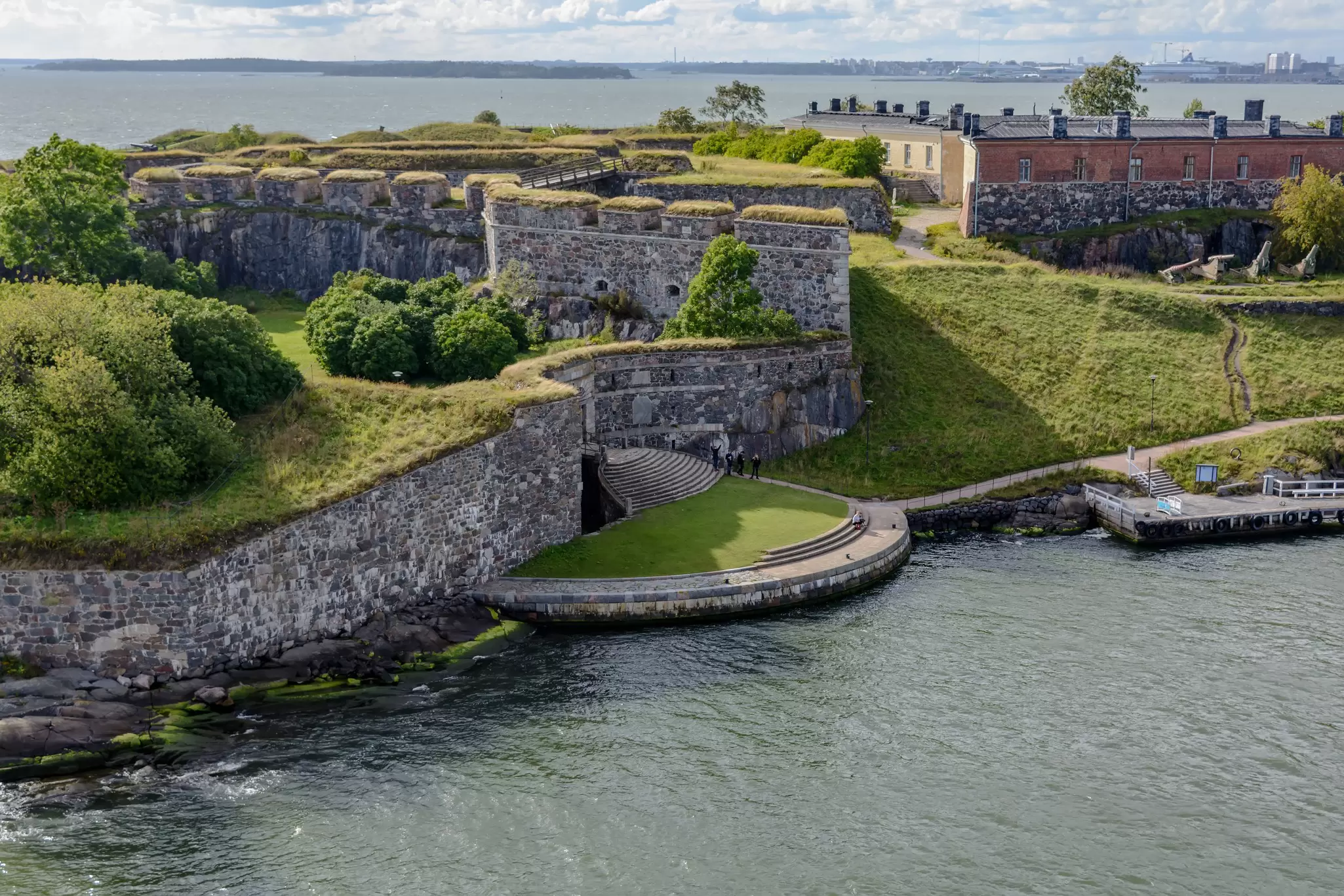Young people are waving with hands to passing cruiseferry at the main symbol of Suomenlinna - Kuninkaanportti (King's Gate) - the principal entrance to the fortress. , License Type: media, Download Time: 2025-12-20T14:00:19.000Z, User: katherineeloisemarsh73, Editorial: false, purchase_order: 56530 - Guidebooks, job: Global Publishing-WIP, client: Estonia, Latvia & Lithuania 11, other: Kat Marsh