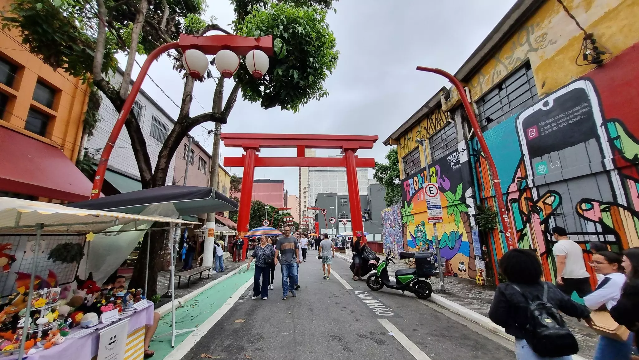 São Paulo SP Brazil: People walk in the Liberdade neighborhood in São Paulo during a cloudy afternoon.
