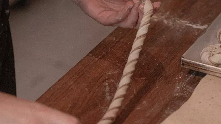 Rolling cardamom buns at Kalve Coffee