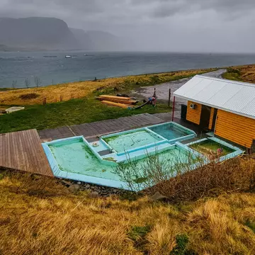 Hot pot, hot water pool, geothermal bath, bathers, Pollurinn, Talknafjoerour, Vestfiroir, Westfjords, North-West Iceland, Iceland, License Type: media, Download Time: 2025-11-24T19:05:45.000Z, User: comptonsheldon109, Editorial: false, purchase_order: 56530 - Guidebooks, job: Global Publishing WIP, client: Experience Iceland 2, other: Compton Sheldon