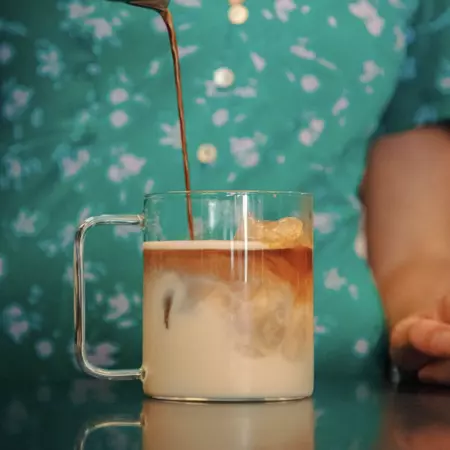 A latte in a clear mug