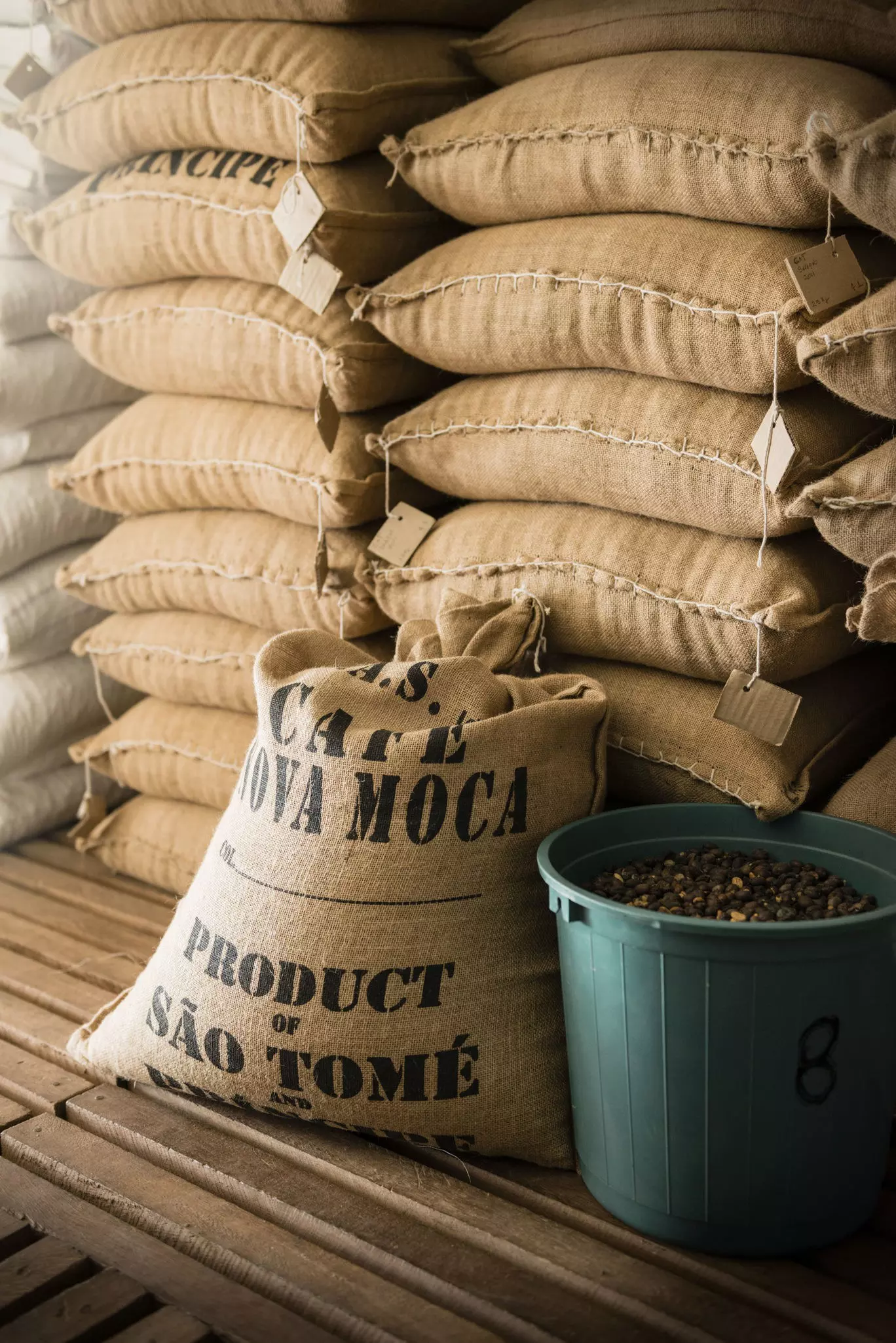 Cocoa beans in hessian sacks ready for export reading Product of São Tomé and Príncipe