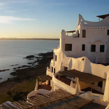 Punta Ballena, Punta del Este, Uruguay. Casapueblo: Architecture by artist Carlos Paez Vilaro. Sunset in August,2018 in South America., License Type: media, Download Time: 2026-02-13T14:41:14.000Z, User: sevelynd12, Editorial: true, purchase_order: 56500 - T&R or Kids, job: Global Publishing WIP, client: 365 Days of Travel 1, other: Sharon Dortenzio
