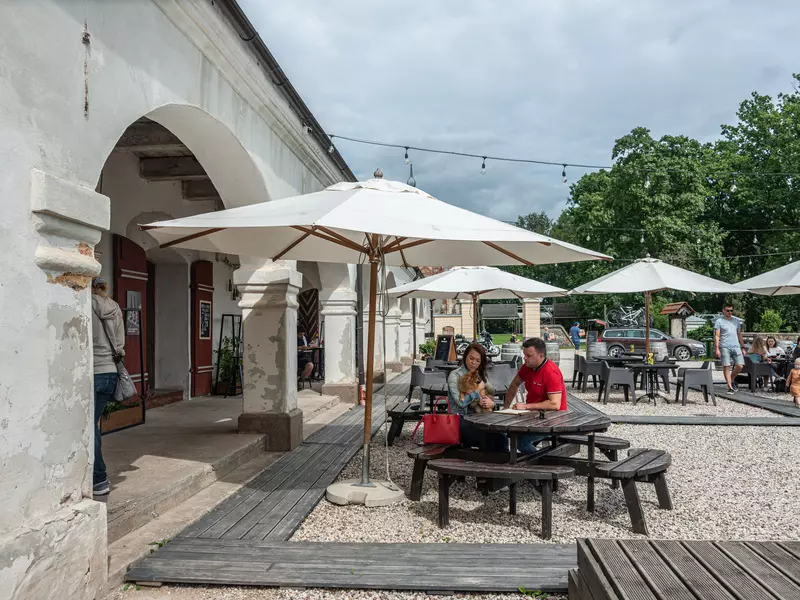 Outdoor seating at Valmiermuiža Brewery