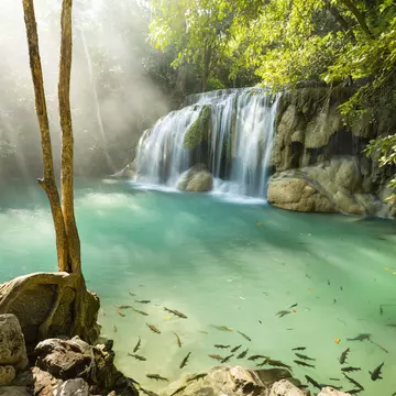 Lonely Planet Traveller Magazine, issue 112, April 2018, Central Thailand
Fish swim in the aqua pool of a waterfall in the Erawan National Park.