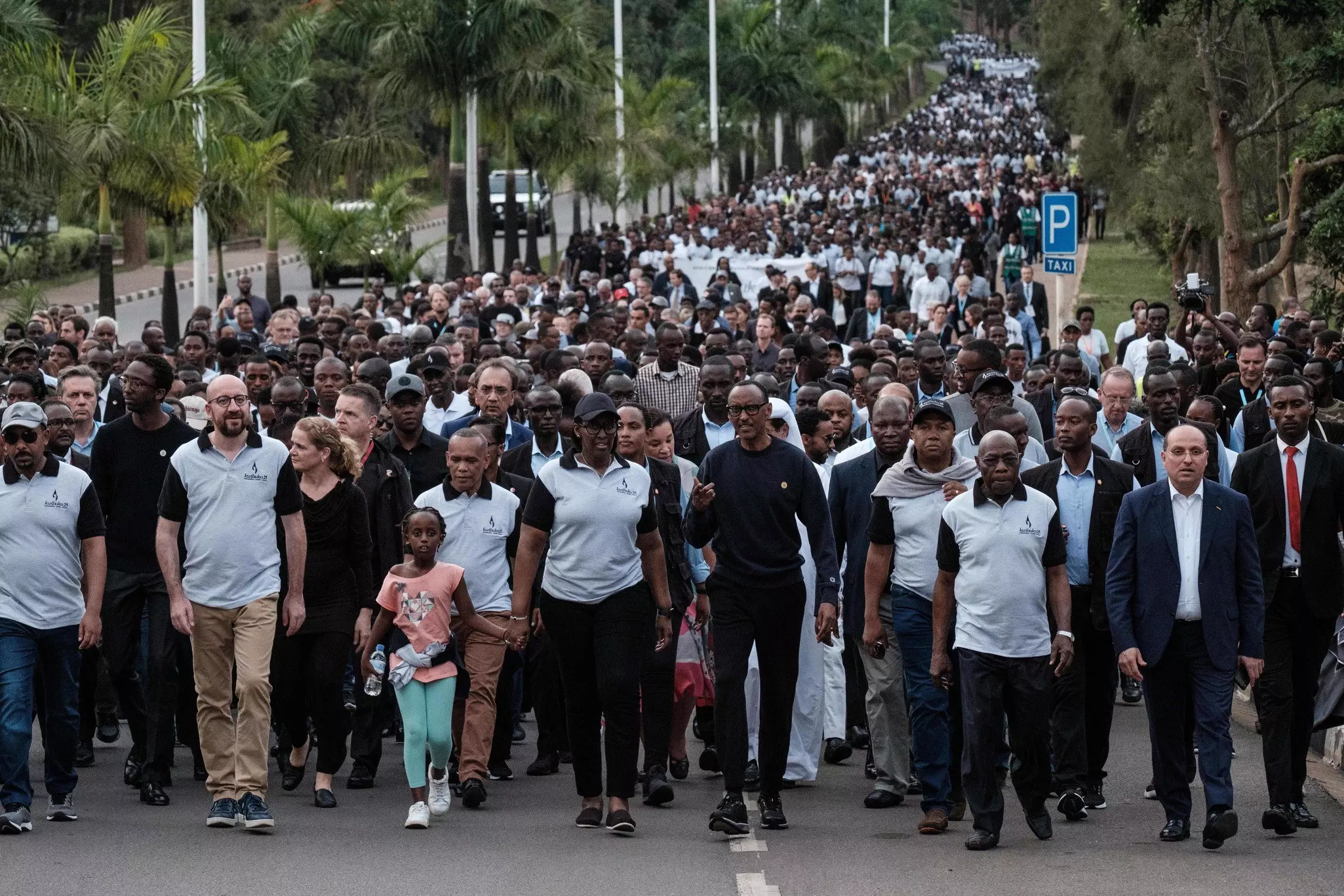 Rwanda's President Paul Kagame (C) walks with his wife Jeanette (next L), Ethiopia's President Abiy Ahamed (L) and Belgium's Prime Minister Charles Michel (2nd L) during the