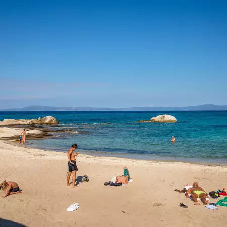 People relaxing on a sandy beach