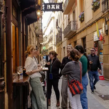 People enjoying a pinxtos tour in San Sebastián, Spain