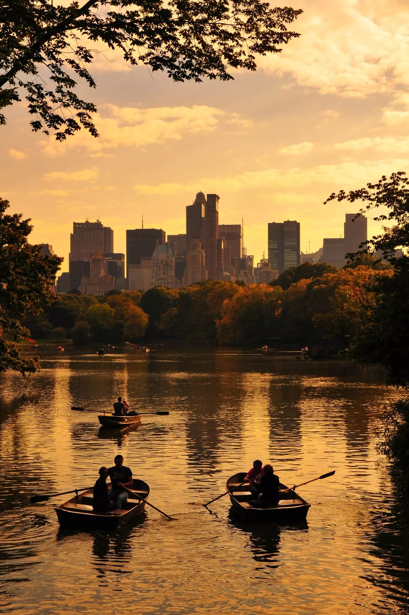 Row boats at sunset on a small lake at the Central Park, Upper West Side, New York City, NY, USA