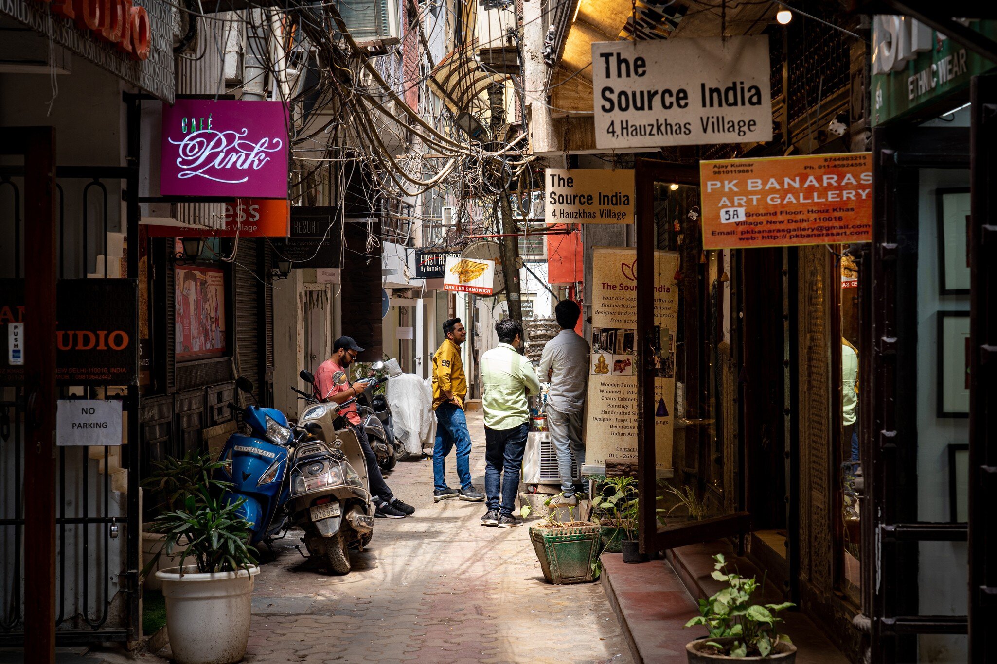 New Delhi, India. People and shops in Hauz Khas Village neighboorhoud.