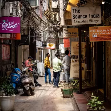 New Delhi, India. People and shops in Hauz Khas Village neighboorhoud.