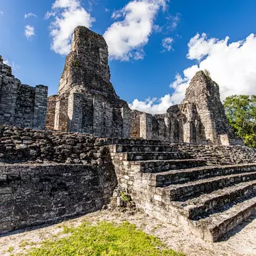 Ancient Mayan temple stairs close up view with three pyramids in Xpujil, Mexico