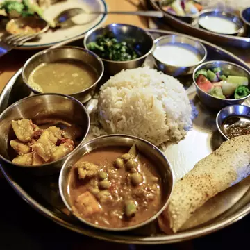 Dal bhat (rice and lentils) is a staple of Nepali cuisine. Maya Karkalicheva/Getty Images
