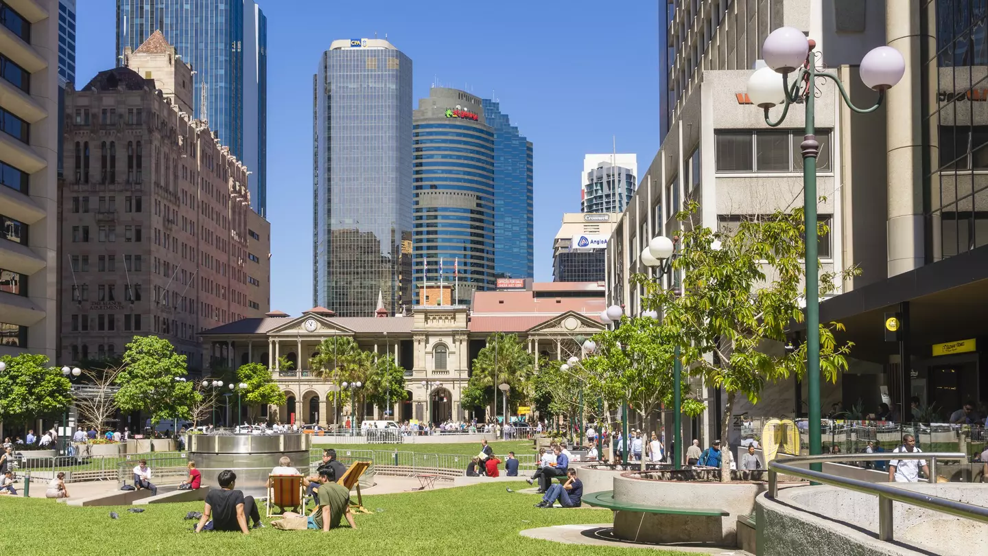 People sitting enjoying the sunshine in Post Office Square in Brisbane