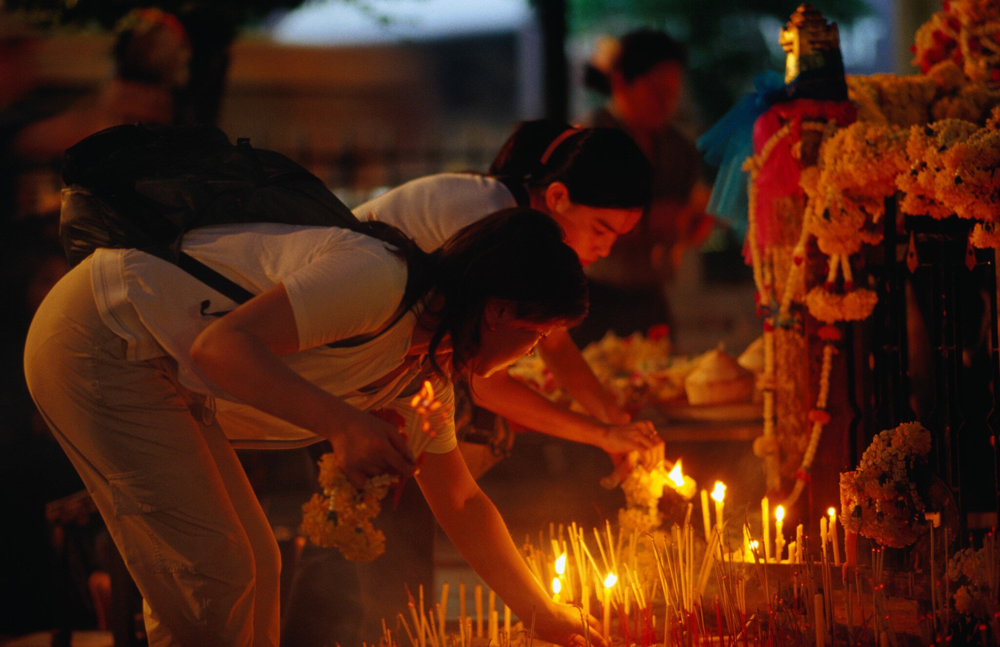 Lighting candles at Erawan Shrine, Khannayao.
12990-39
Asia, Bangkok, South-East Asia, Thailand, buddhist, candle, culture, custom, flora, flower, incense, lighting, offering, people, plant, prayer, religion, religions, ritual