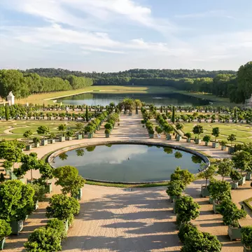 VERSAILLES, FRANCE;  July 23, 2022: Beautiful image of Parterre De L'Orangerie in the majestic gardens of the palace of versailles during the show of fountains and musical gardens., License Type: media, Download Time: 2025-11-18T13:58:48.000Z, User: rhylton_redventures, Editorial: true, purchase_order: 65050 - Digital Destinations and Articles, job: Lonely Planet, client: social, other: Rhianydd Hylton