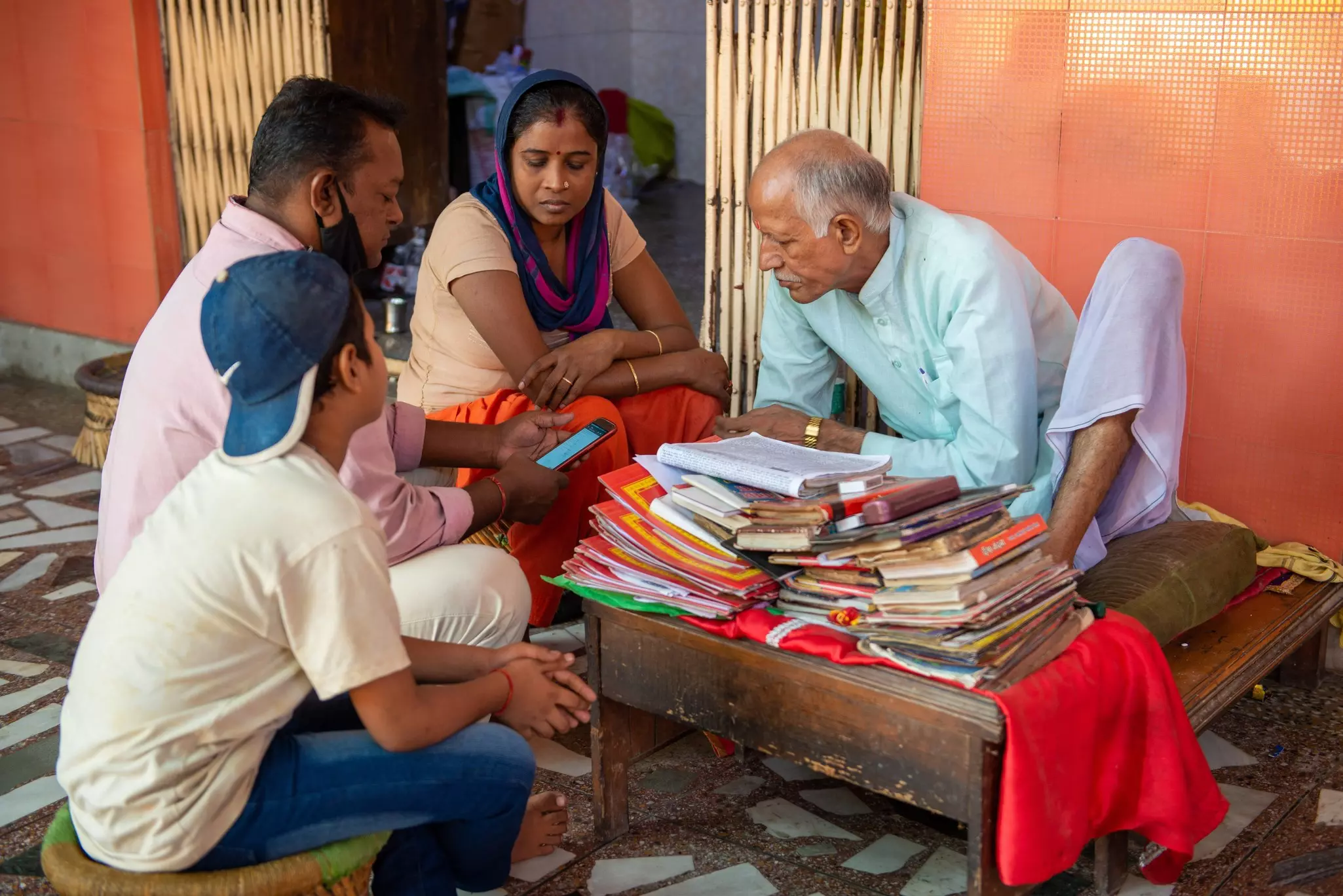 A family consulting a Jyotish astrologer in Delhi, India.