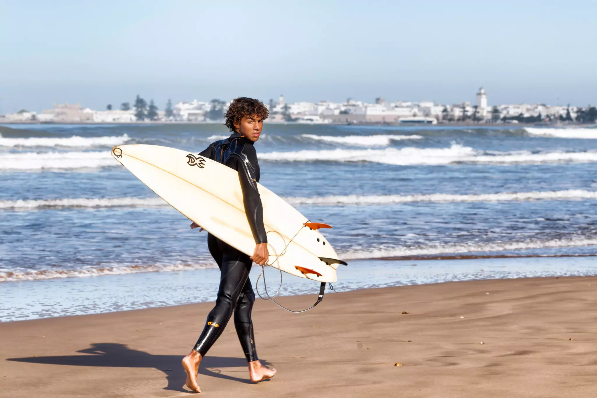 A surfer in Essaouira, Morocco. cdrin/Shutterstock
