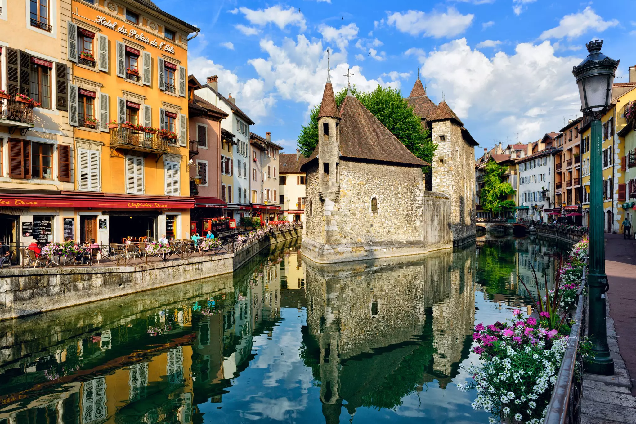 A canal runs between buildings in a city's old town