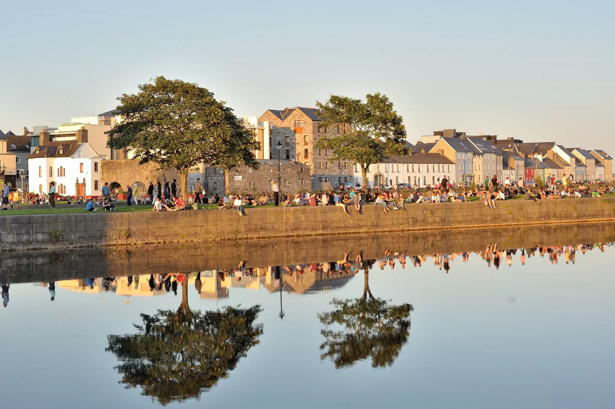 Spanish Arch, Galway, Ireland July 2017 ,  lots of people enjoying a sunny day, License Type: media, Download Time: 2026-04-08T16:01:59.000Z, User: nic.dhoedt_lonelyplanet, Editorial: true, purchase_order: 56530 - Guidebooks, job: Global Publishing WIP, client: Lonely Planet Best Road Trips Ireland 5, other: Nicolas D'Hoedt