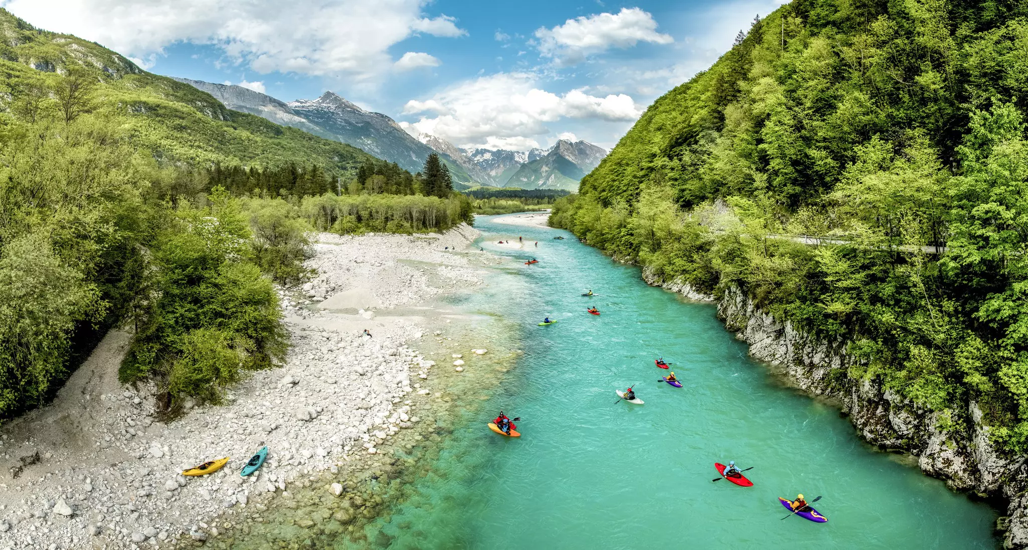 People kayaking on the river Soča in Slovenia