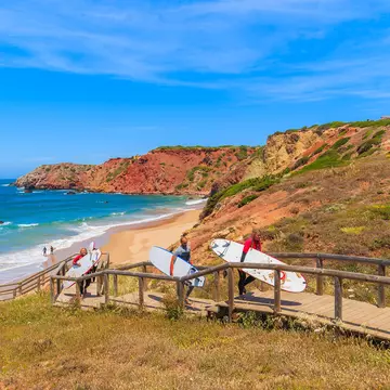 PRAIA DO AMADO BEACH, surfers walking on footbridge from beach in Algarve region.
adventure, algarve, amado, atlantic, azure, bay, beach, blue, board, cliff, coast, coastline, destination, do, europe, green, group, holiday, landscape, man, nature, ocean, people, plant, portugal, portuguese, rock, sand, scenic, sea, seascape, seaside, shore, spain, sport, spring, summer, sunny, surfer, surfing, swimming, tourist, travel, turquoise, vacation, view, walk, water, wave, woman