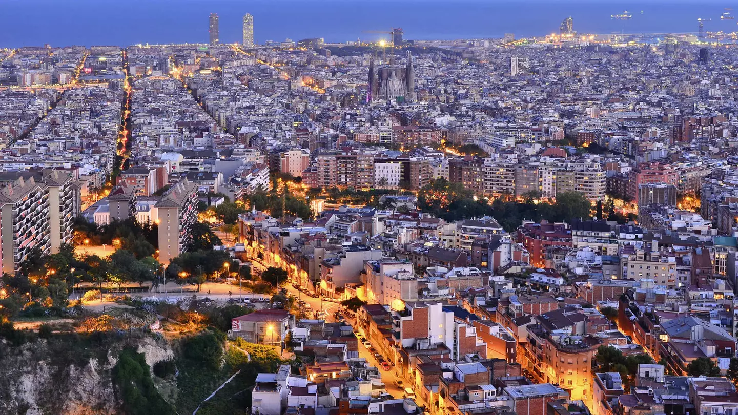 Overview of Barcelona illuminated at dusk