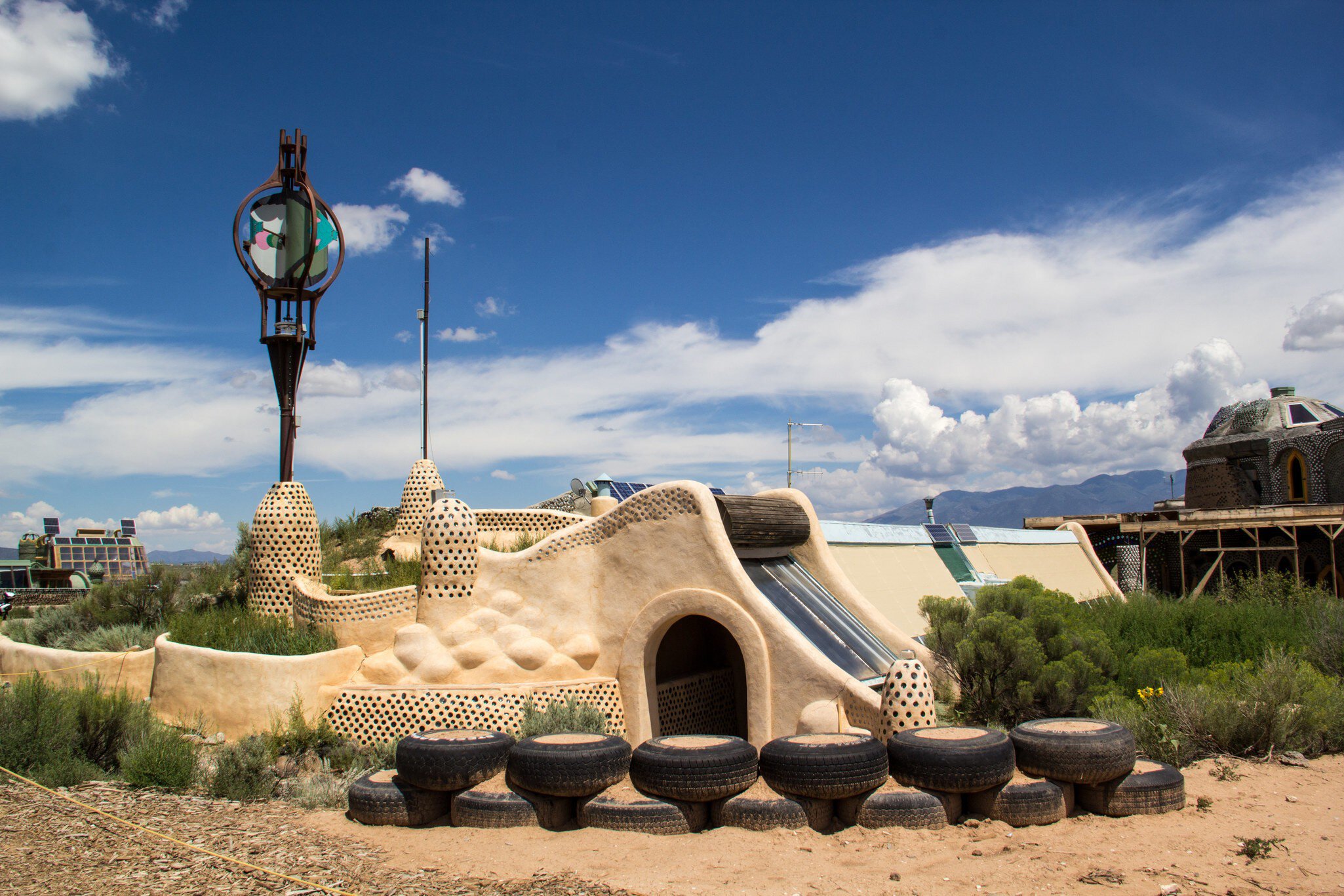 TAOS, NEW MEXICO-AUGUST 13: Building materials sit outside an earthship being built in Taos on August 13, 2014. Earthships are environmentally friendly homes made of recycled materials.